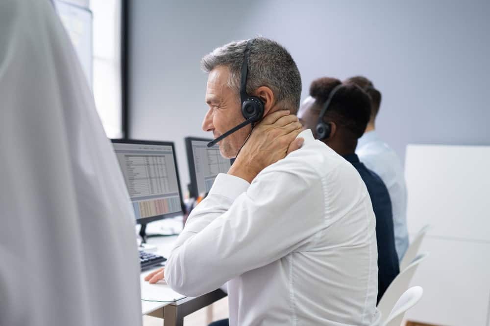 businessman suffering from neck pain