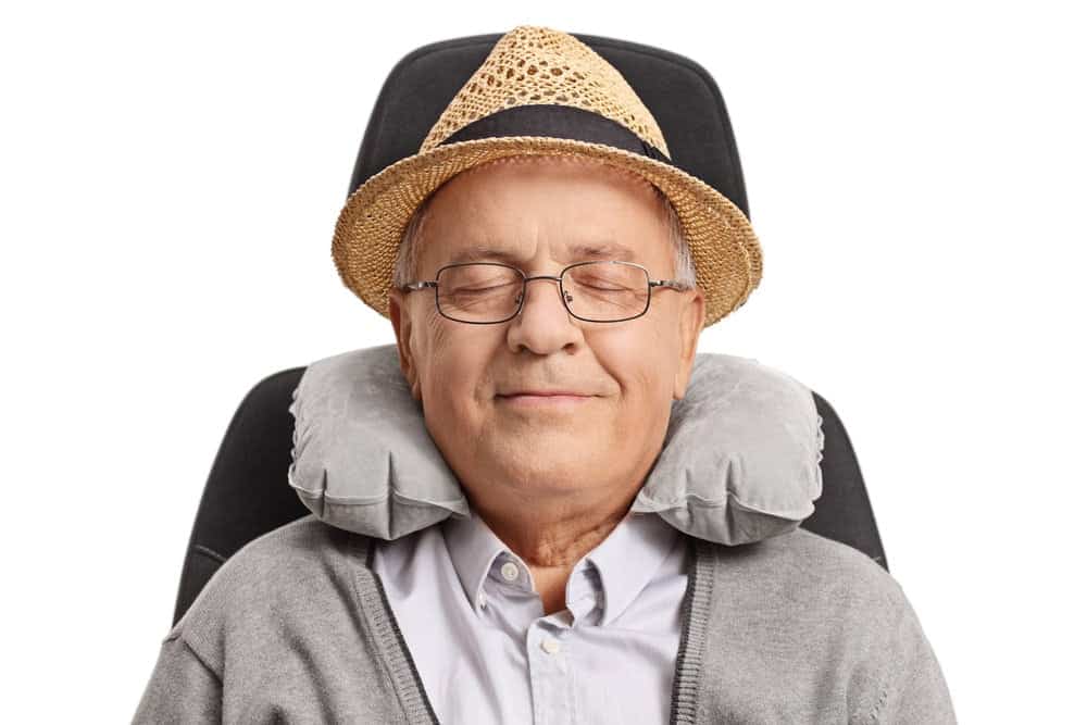 senior man relaxing with neck support