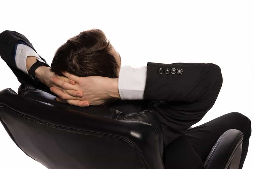 Relaxed businessman sitting in a comfortable chair