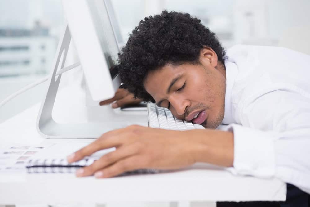 a man sleeping at desk