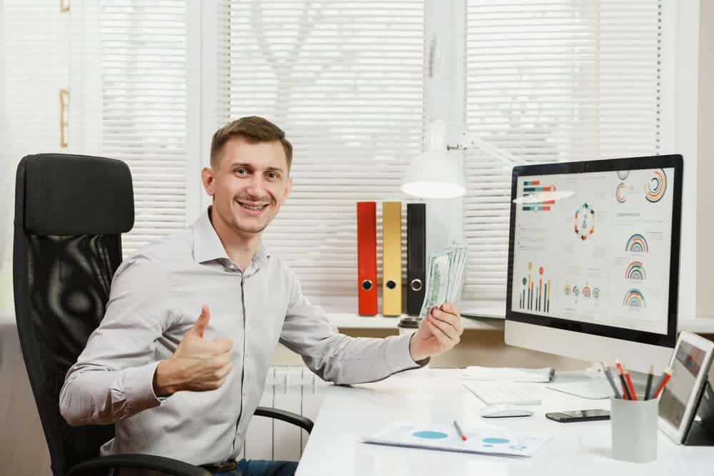 businessman sitting in IKEA Markus office chair