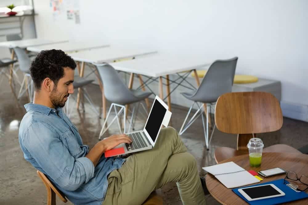 man sitting in low back chair