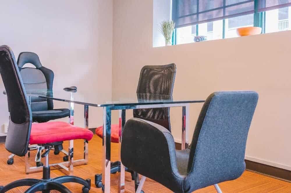 mesh and leather office chairs in a room