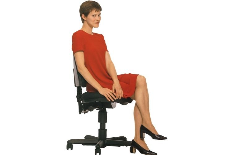 Sitting on armless chair 