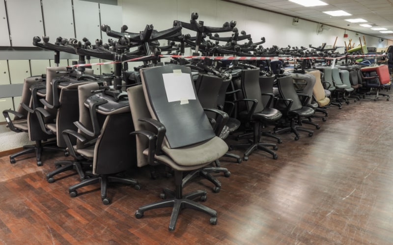 loads of old office chairs are awaiting to be recycled