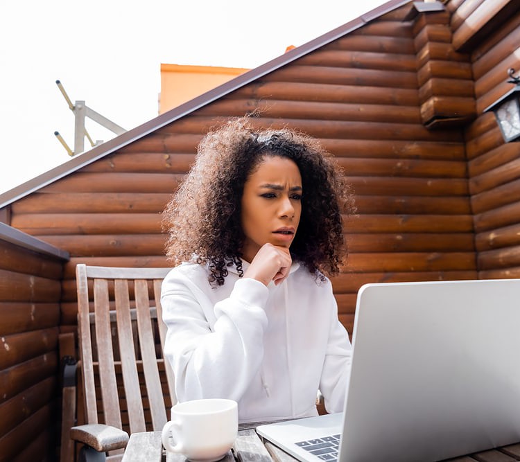 sitting on a wooden chair to work