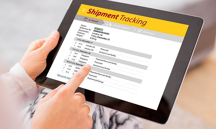 A woman holding tablet to track shipment