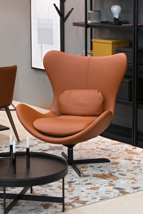 Brown leather swivel chair in living room