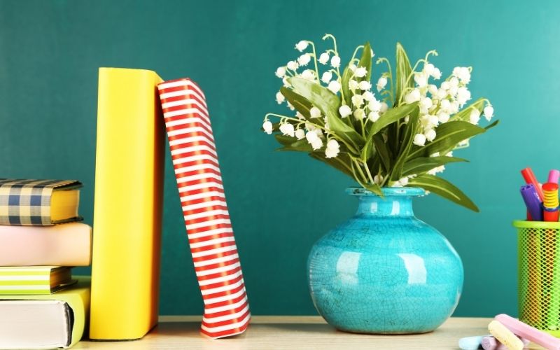 Decorate desk with book and flowers