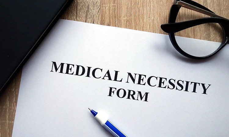 Medical necessity form on table