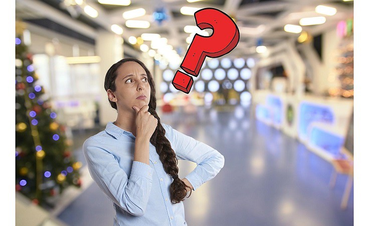 Woman at shopping center with question mark