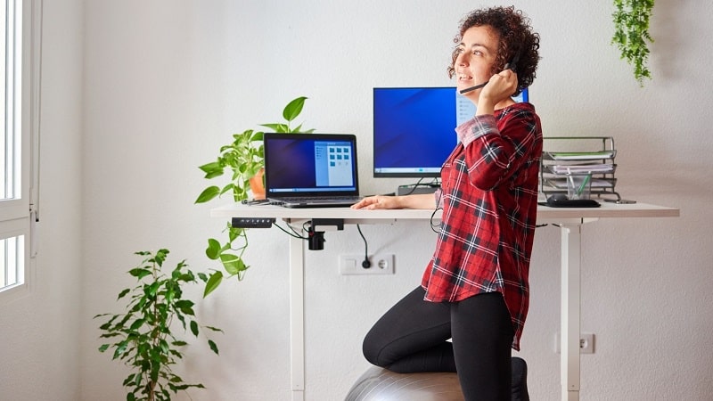 Woman working at a standing desk