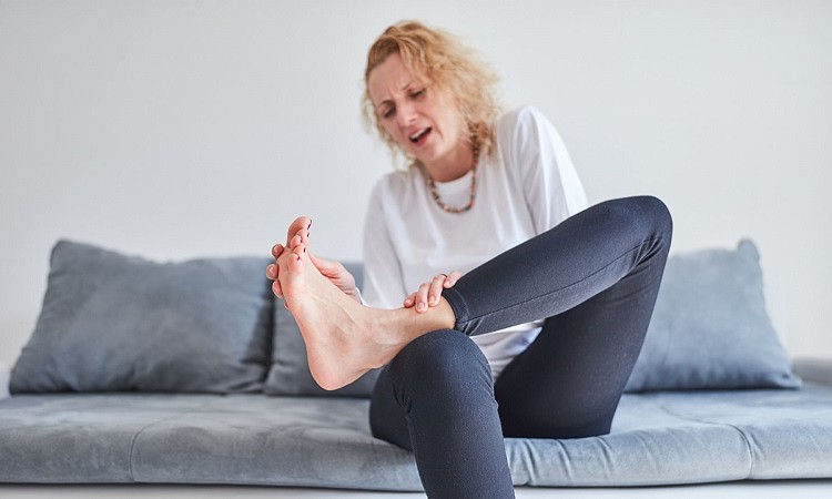 Woman with leg joints pain