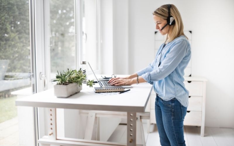 Woman working at a standing desk