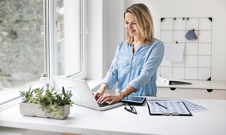 Woman working on standing desk