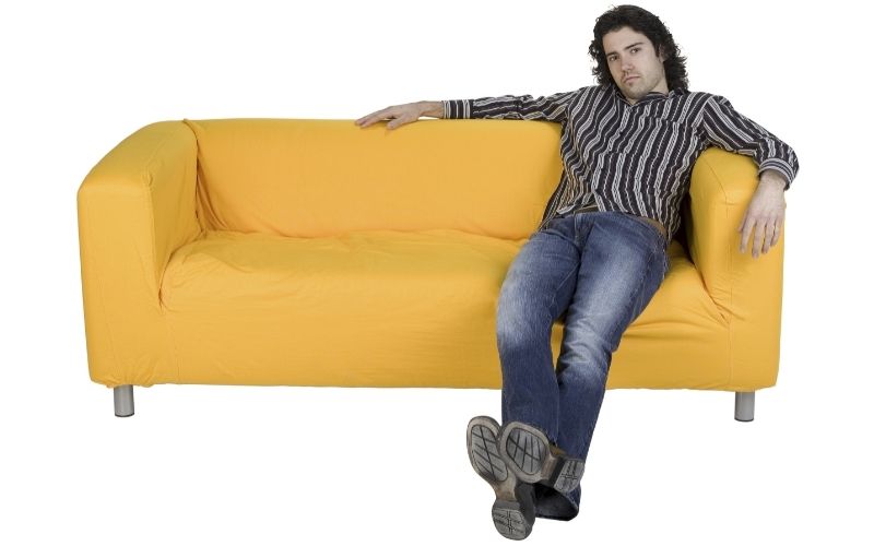 Man slouching on sofa