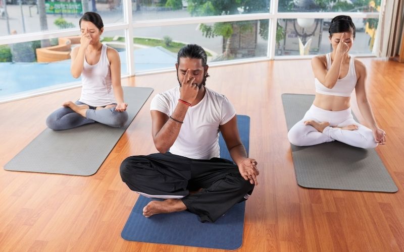 People practice breathing technique