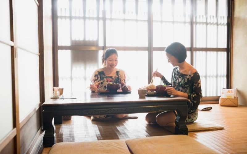 Woman sitting in seiza style and eating together