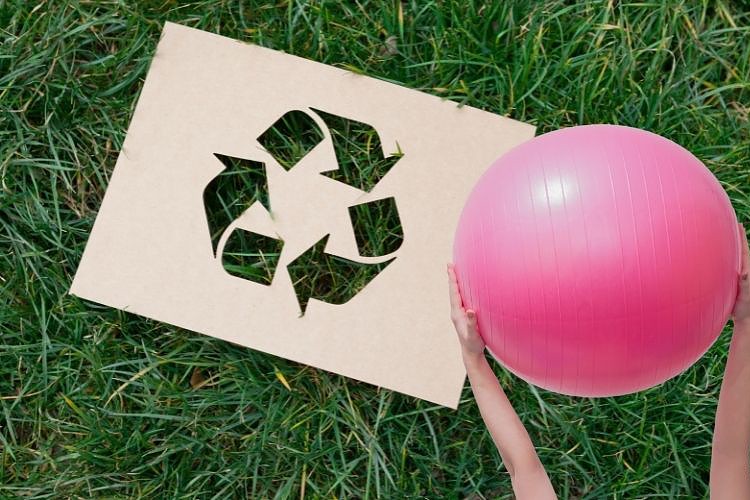 Exercise ball and recycled symbol