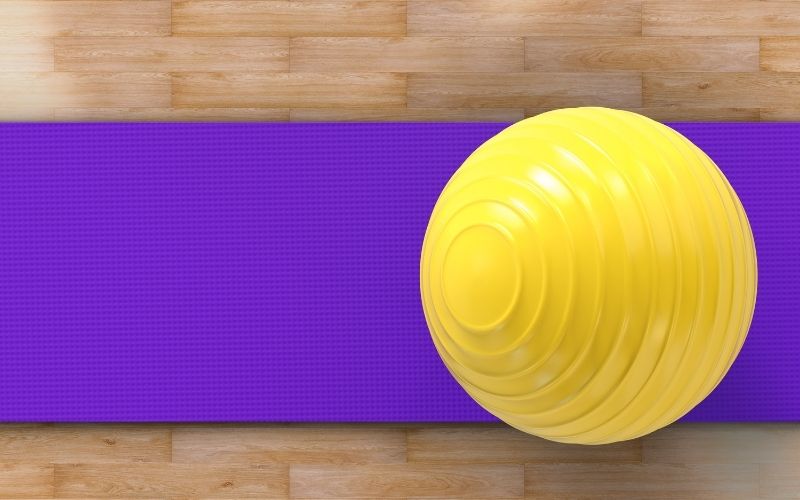 Exercise ball on a yoga mat