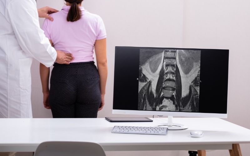 sitting slumped on a desk can aggravate your scoliosis