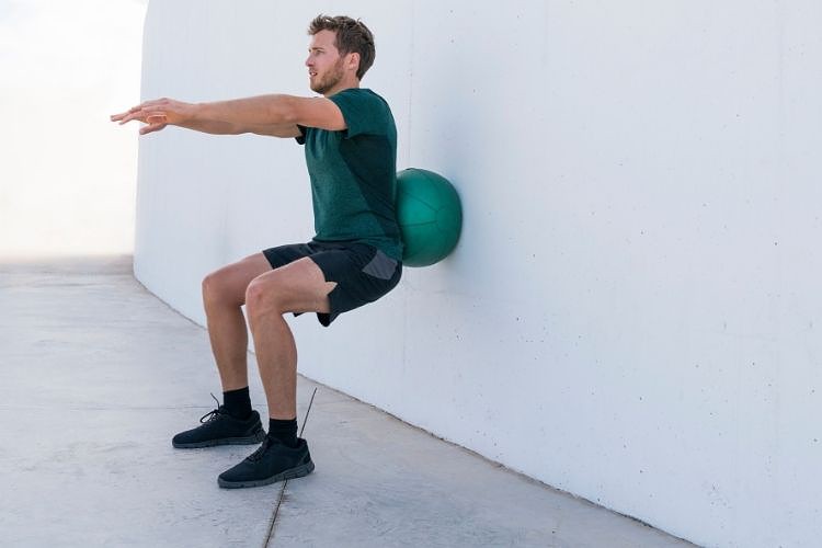 wall squat with exercise ball