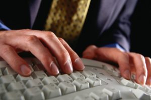 A Man using Ergonomic Keyboard