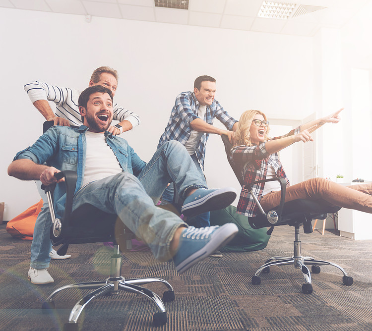 A office using chairmat and happy workers playing on it