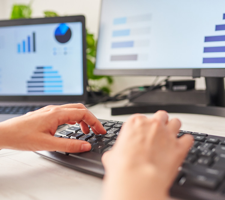 A person using ergonomic keyboard for working