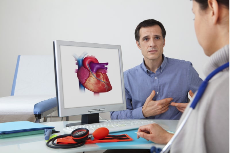 Man consulting with doctor about his heart disease