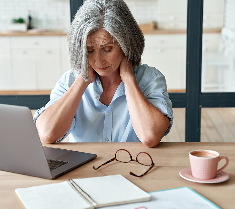 A woman is having Muscular soreness from working