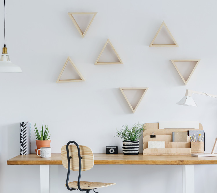 A wooden desk in a white office