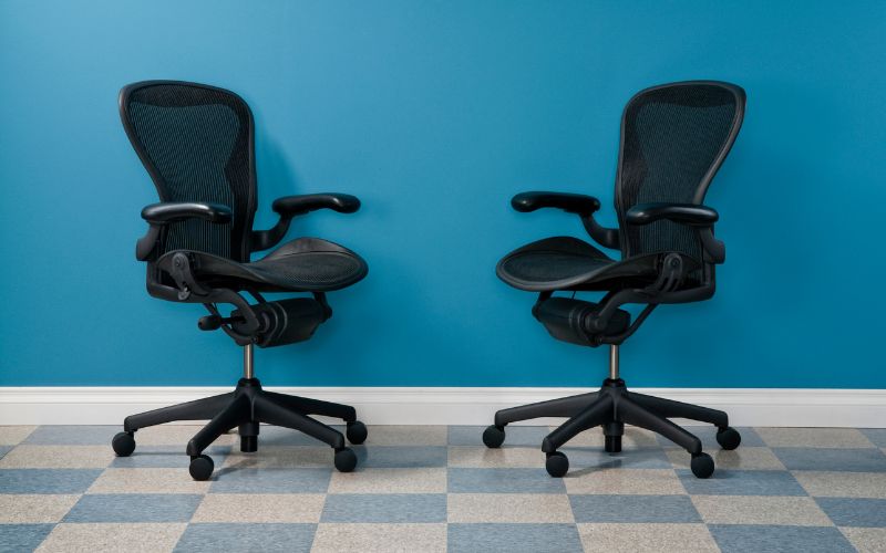 Black office chairs with adjustable ergonomic features