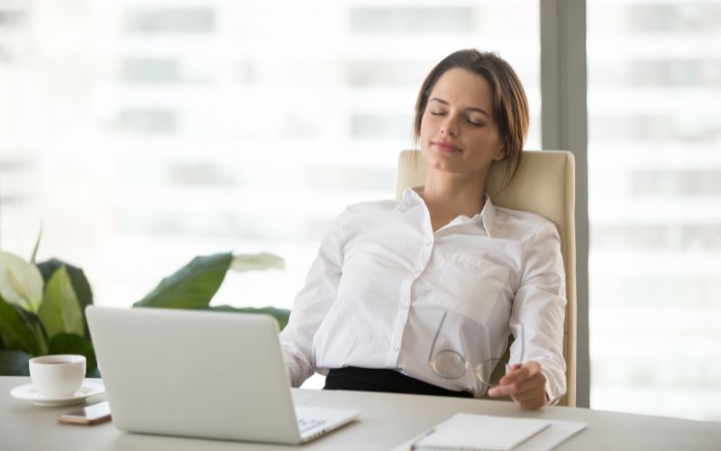 a lady is relaxing in a comfortable office chair